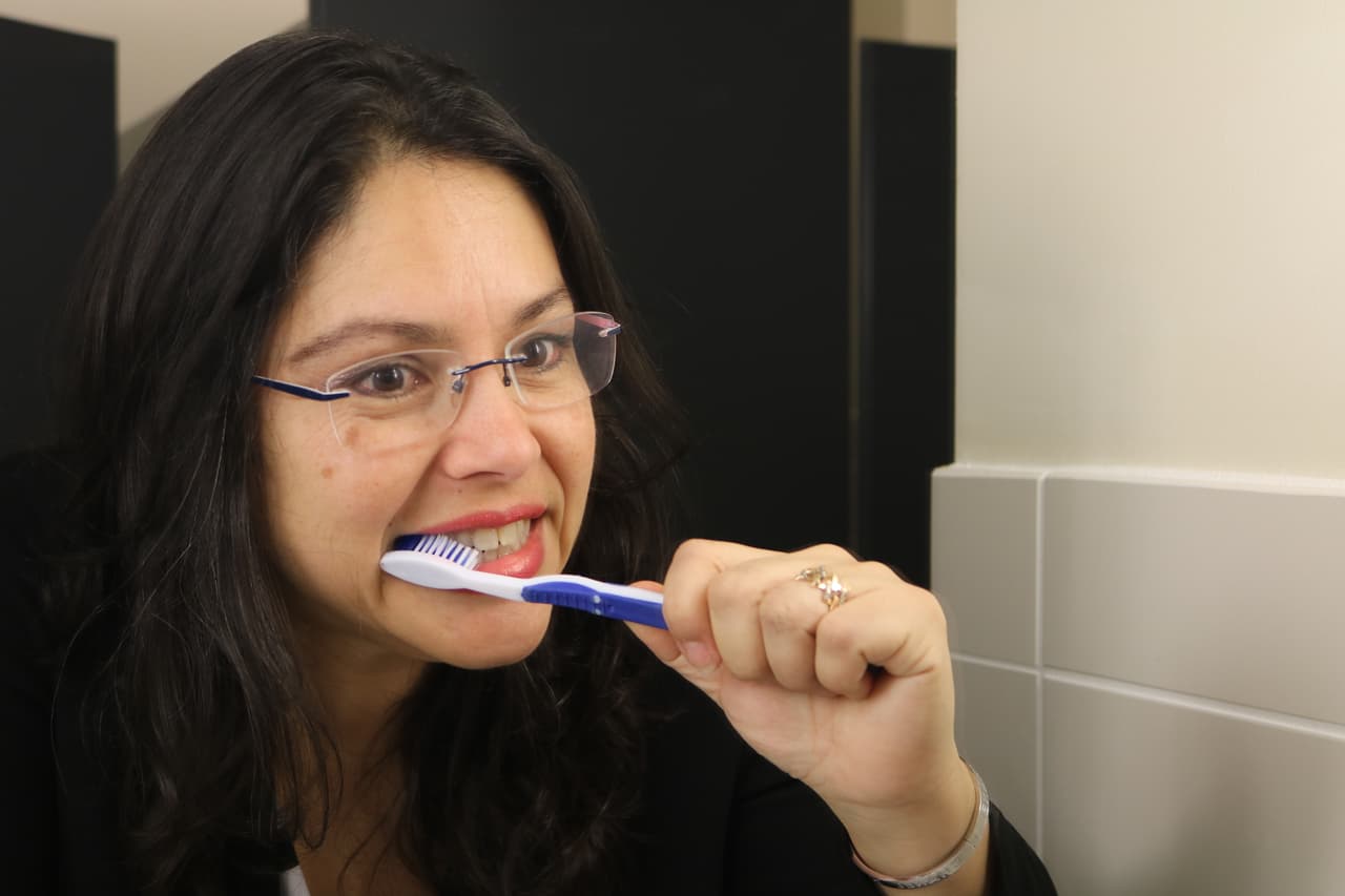 <b>1. Brush at least twice a day: </b>Start and end the day by brushing your teeth, which will reduce bacteria in the mouth and remove leftover food particles. This will help prevent cavities and gum disease, teeth staining, and bad breath. Place the toothbrush at your gum line and 
<b>gently</b> vibrate it back and forth for
<b> at least two minutes</b> Also, don’t forget to brush your tongue!