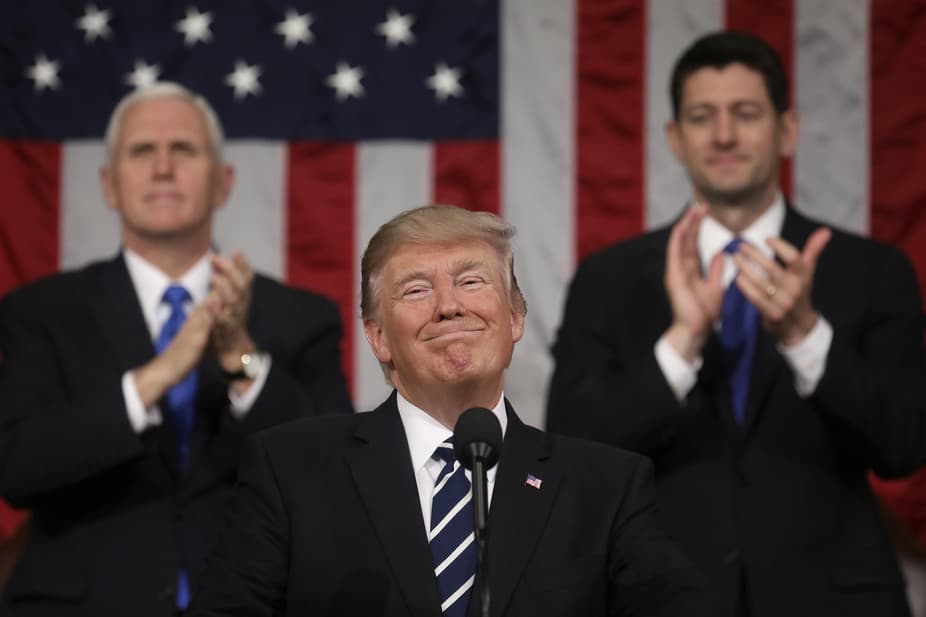 Trump addresses a joint session of Congress on Feb. 28, 2017, as VP Mike Pence and House Speaker Paul Ryan applaud.