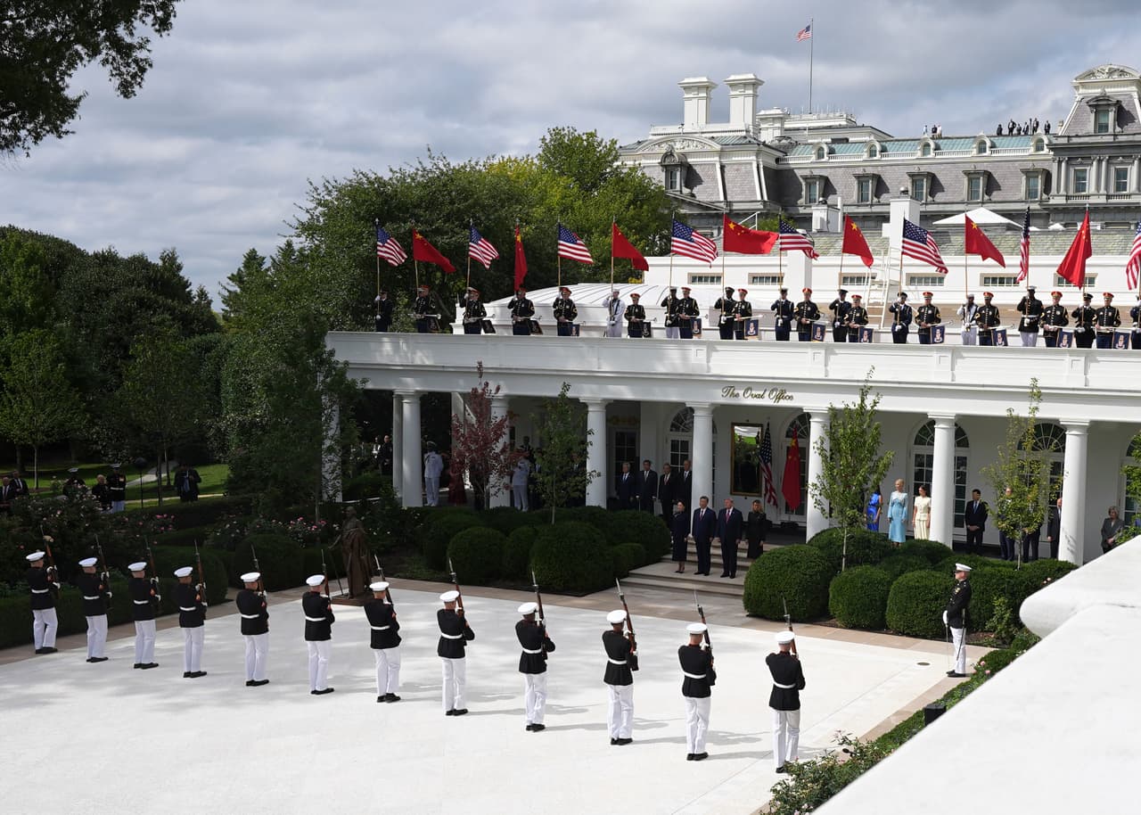 President Donald Trump, center right, first lady Melania Trump, right, China's President Xi Jinping, center left, and his wife Peng Liyuan watch a military review in the Rose Garden of the White House, Thursday, Sept. 24, 2026, in Washington. (AP Photo/Alex Brandon)