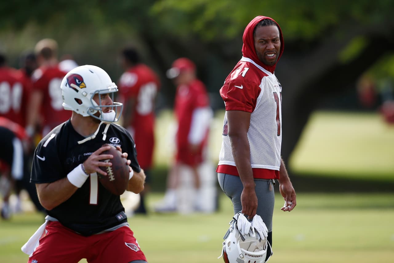 Arizona Cardinals wide receiver Larry Fitzgerald, right, watches quarterback Trevor Knight (1) as quarterbacks run drills during an NFL football organized team activity, Thursday, June 1, 2017, at the team training facility in Tempe, Ariz. (AP Photo/Ross D. Franklin)
