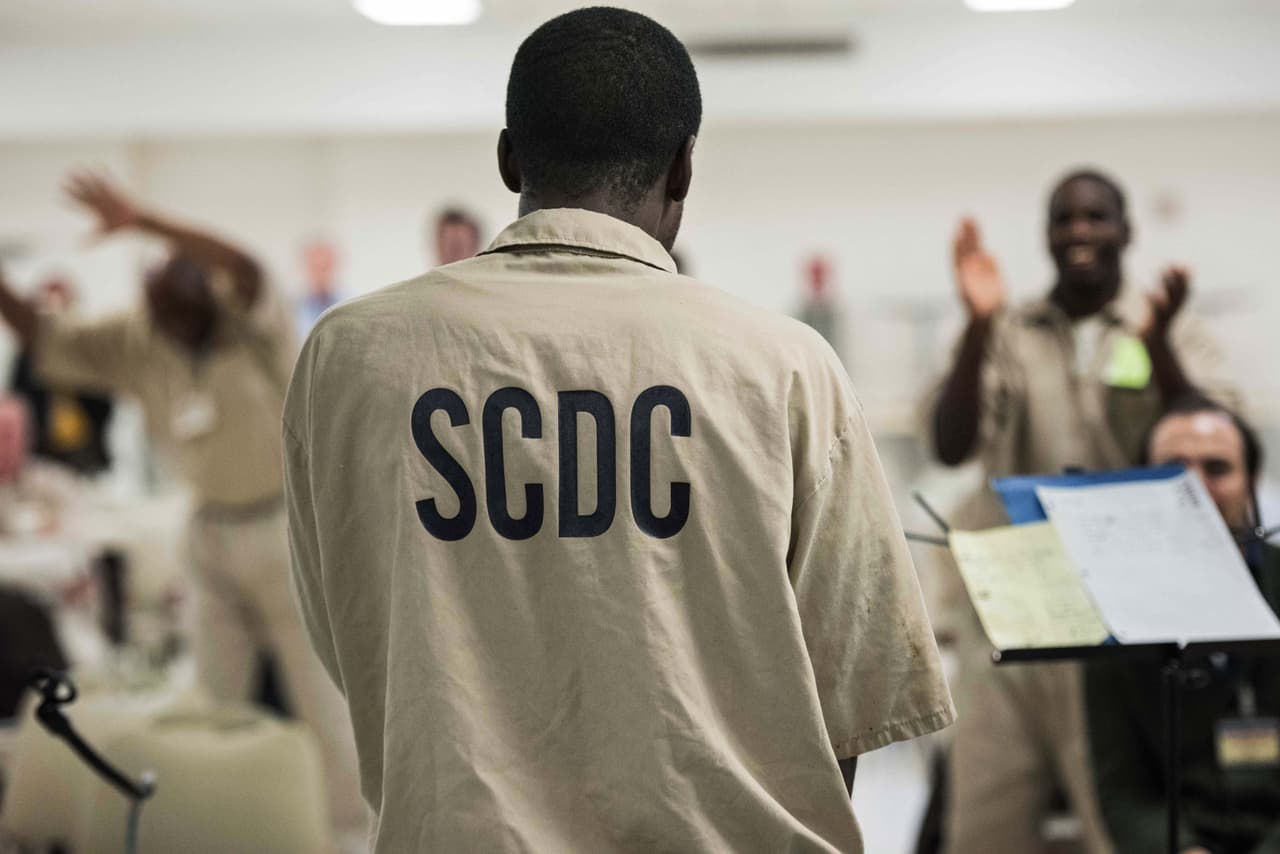 An inmate raps during a music workshop at the Lee Correctional Institution in Bishopville, S.C., Tuesday, Feb. 9, 2016. Several dozen inmates will perform original music in a concert on Feb. 14, 2016 for the larger incarcerated community, staff, officers, and local and state officials. The concert is a result of a weeklong workshop with the Decoda chamber ensemble. (AP Photo/Sean Rayford)