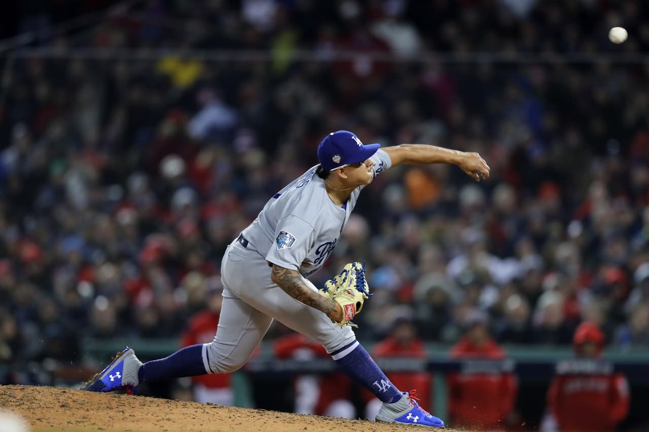 BOSTON, MA - OCTOBER 23: Julio Urias #7 of the Los Angeles Dodgers delivers the pitch during the sixth inning against the Boston Red Sox in Game One of the 2018 World Series at Fenway Park on October 23, 2018 in Boston, Massachusetts. (Photo by Elsa/Getty Images)