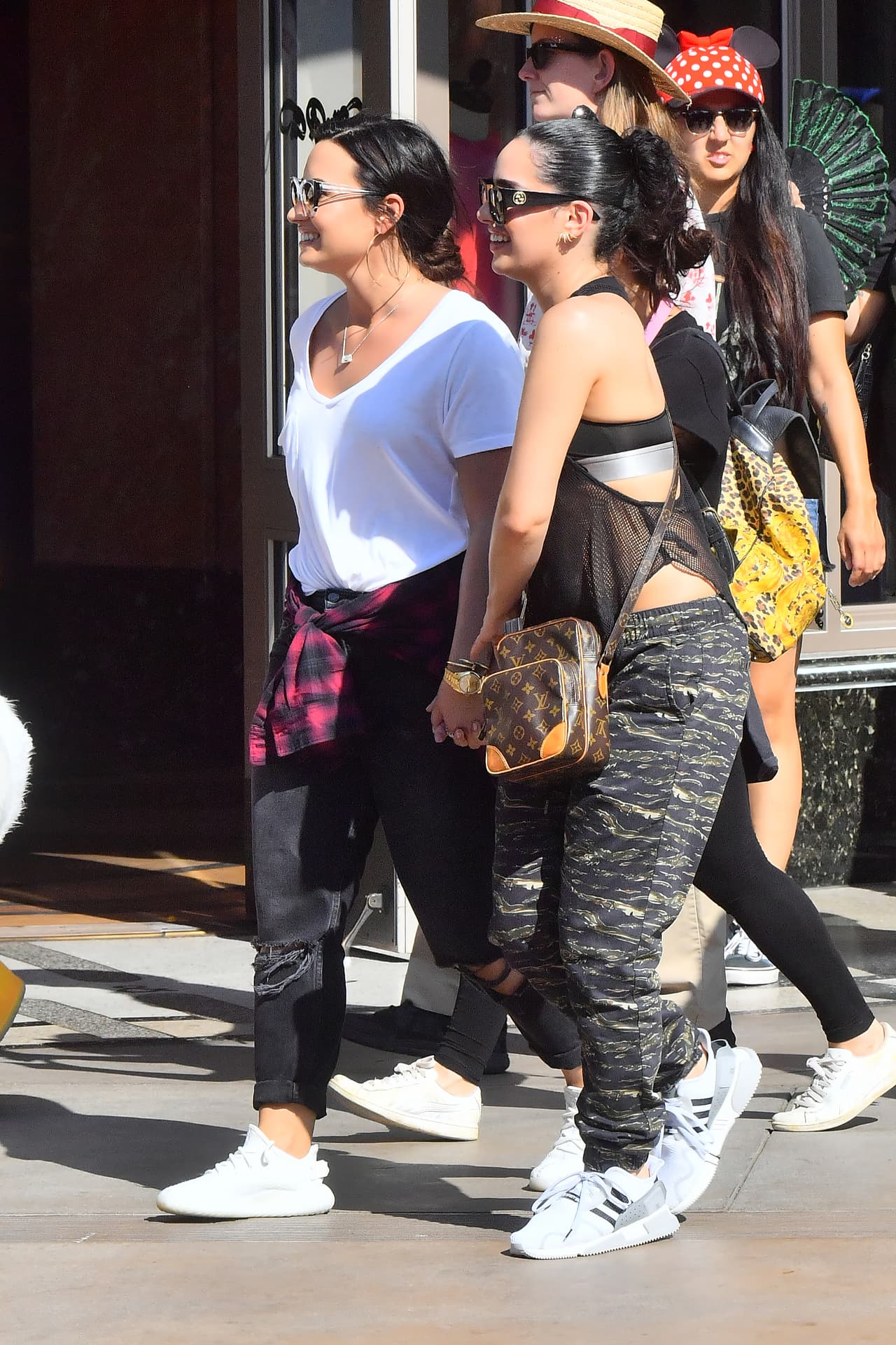 Photo © 2017 Mega/The Grosby Group EXCLUSIVE Los Angeles, CA September 11, 2017 Demi Lovato holds hands with a mystery woman while spending a happy day a Disneyland gets photobombed by Donald Duck. Demi and her new lady walked hand in hand all day Long as they enjoyed a day. they were seen riding the California screaming rollercoaster. Demi looked extremely happy.