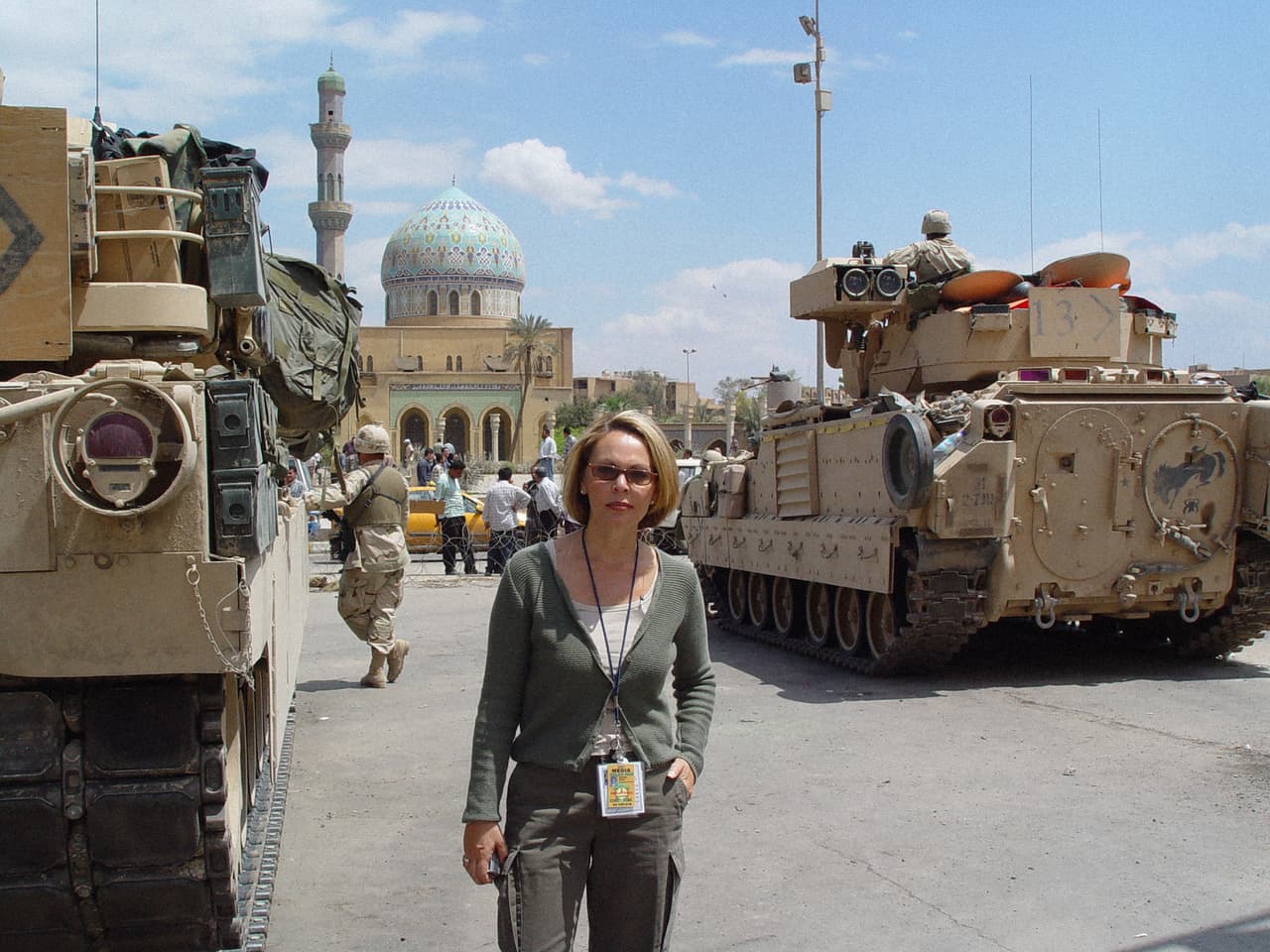 María Elena Salinas next to the US tanks in Baghdad, Iraq. She was born in Los Angeles, California in 1954, to Mexican parents.