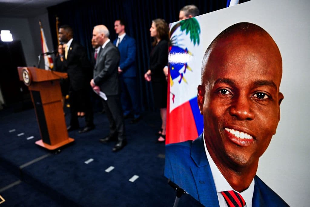 The US Attorney's Office of the Southern District of Florida holds a press conference to announce new arrests and charges in the July 7, 2021, assassination of Haitian President Jovenel Moise (portrait), in Miami on February 14, 2023.