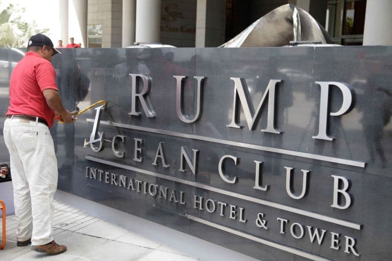 The Trump name comes off a sign at the entrance to the Trump Ocean Club International Hotel & Tower, where a dispute is ongoing for control of the hotel's management.