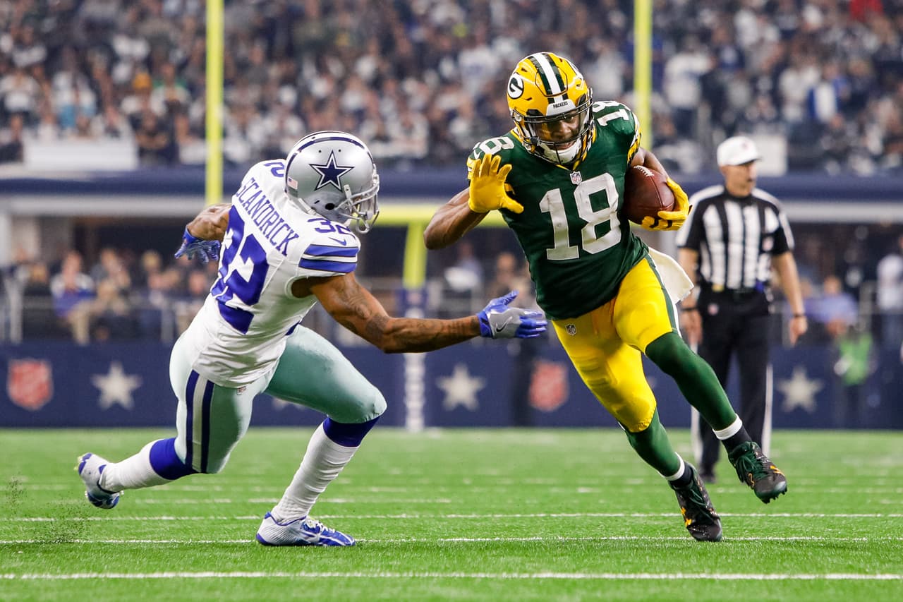 Green Bay Packers wide receiver Randall Cobb (18) makes a reception with Dallas Cowboys cornerback Orlando Scandrick (32) defending during the NFC Divisional Playoff game between the Dallas Cowboys and Green Bay Packers on January 15, 2017, at AT&T Stadium in Arlington, TX.
