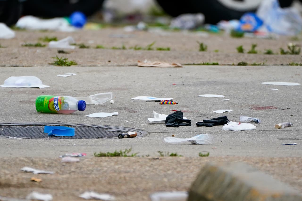 First-aid items and debris are seen in the area of a mass shooting incident in the Southern District of Baltimore, Sunday, July 2, 2023. Police say a number of people were killed and dozens were wounded in a mass shooting that took place during a block party just after midnight. (AP Photo/Julio Cortez)