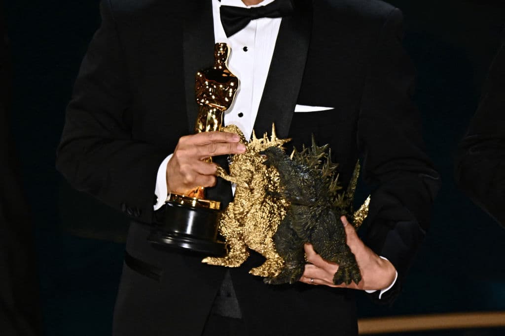 Masaki Takahashi holds statuettes as he accepts the award for Best Visual Effects for "Godzilla Minus One" onstage during the 96th Annual Academy Awards at the Dolby Theatre in Hollywood, California on March 10, 2024. (Photo by Patrick T. Fallon / AFP) (Photo by PATRICK T. FALLON/AFP via Getty Images)