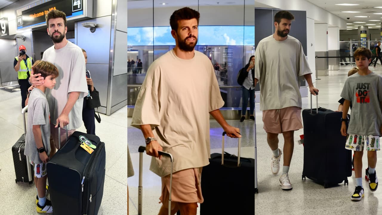 Piqué parecía proteger a sus hijos de los paparazzi a su llegada al aeropuerto de Miami este 19 de junio.