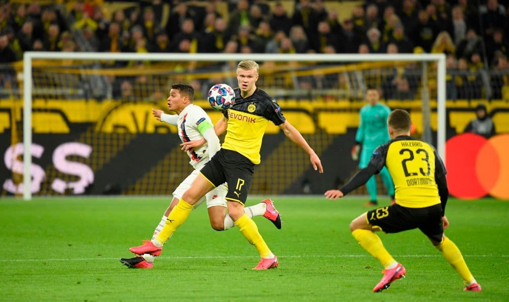 Dortmund's Norwegian forward Erling Braut Haaland (C) vies for the ball with Paris Saint-Germain's Brazilian defender Thiago Silva (L) during the UEFA Champions League Last 16, first-leg football match BVB Borussia Dortmund v Paris Saint-Germain (PSG) in Dortmund, western Germany, on February 18, 2020. (Photo by Ina Fassbender / AFP) (Photo by INA FASSBENDER/AFP via Getty Images)