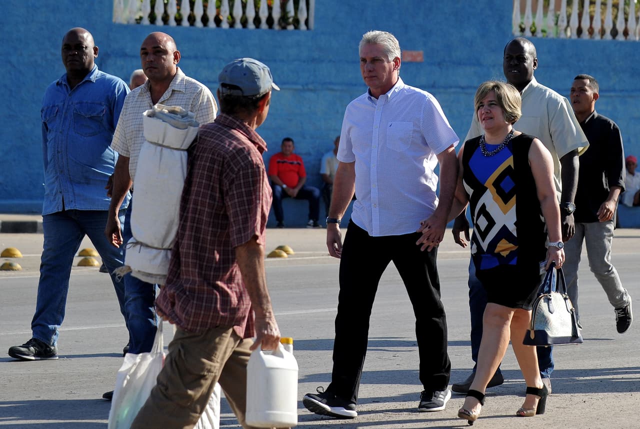 Cuba's First Vice-President Miguel Diaz-Canel (2-R) and his wife Lis Cuesta arrive at a polling station in Santa Clara, Cuba, during an election to ratify a new National Assembly, on March 11, 2018. Cubans vote to ratify a new National Assembly on Sunday, a key step in a process leading to the election of a new president, the first in nearly 60 years from outside the Castro family. The new members of the National Assembly will be tasked with choosing a successor to 86-year-old President Raul Castro when he steps down next month. / AFP PHOTO / Yamil LAGE (Photo credit should read YAMIL LAGE/AFP/Getty Images)