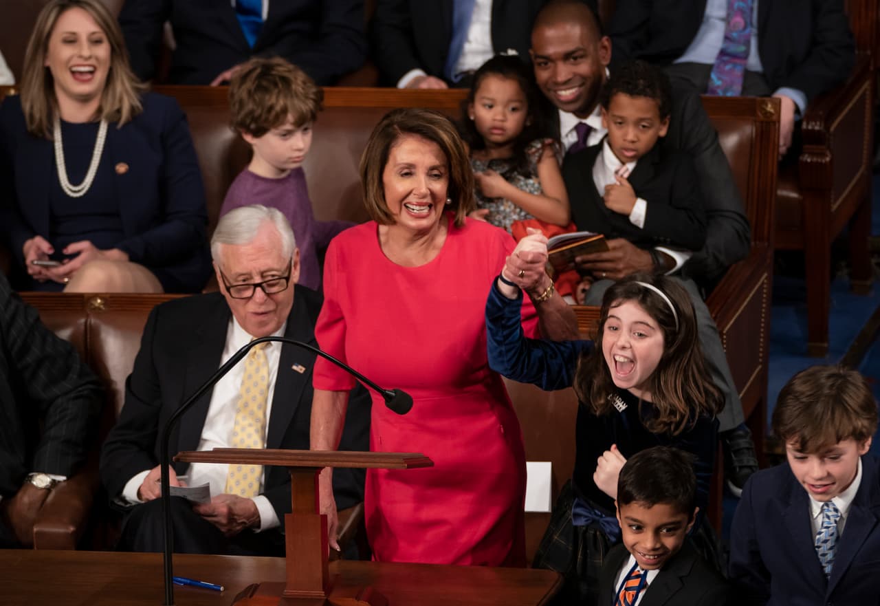 With some enthusiastic assistance from her grandchildren, House Democratic Leader Nancy Pelosi of California smiles as she casts her vote for herself to be speaker of the House on the first day of the 116th Congress, at the Capitol in Washington, Thursday, Jan. 3, 2019. (AP Photo/J. Scott Applewhite)