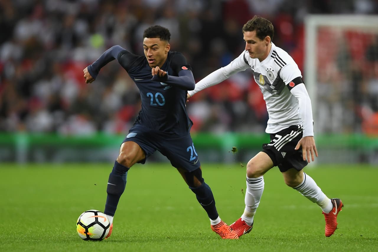 LONDON, ENGLAND - NOVEMBER 10: Jesse Lingard of England attempts to get away from Sebastian Rudy of Germany during the International friendly match between England and Germany at Wembley Stadium on November 10, 2017 in London, England. (Photo by Mike Hewitt/Bongarts/Getty Images)
