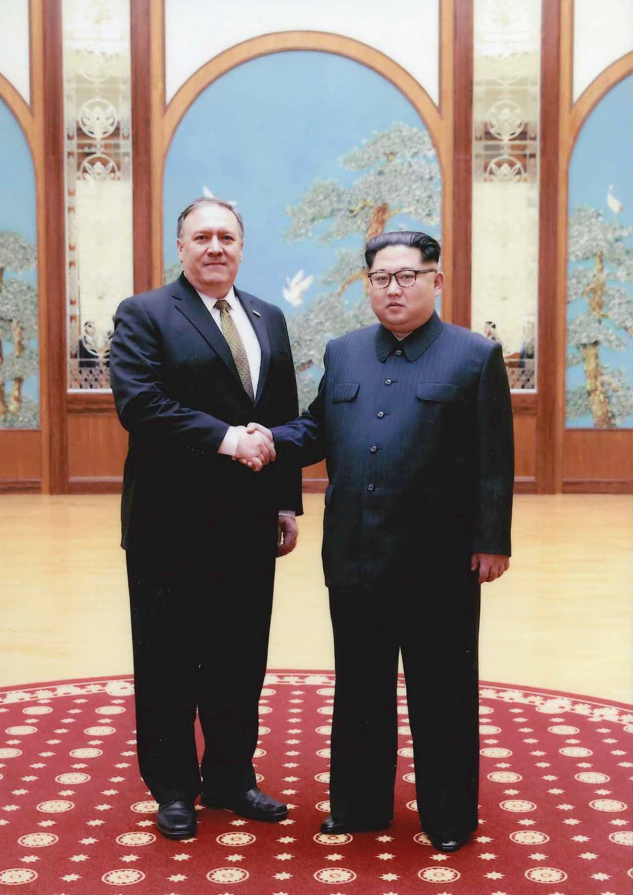 PYONGYANG, NORTH KOREA - UNDATED: In this handout provided by The White House, CIA director Mike Pompeo (L) shakes hands with North Korean leader Kim Jong Un in this undated image in Pyongyang, North Korea. Pompeo, now confirmed as Secretary of State, spoke with Kim for more than an hour during a secret visit over the Easter weekend. (Photo by The White House via Getty Images)