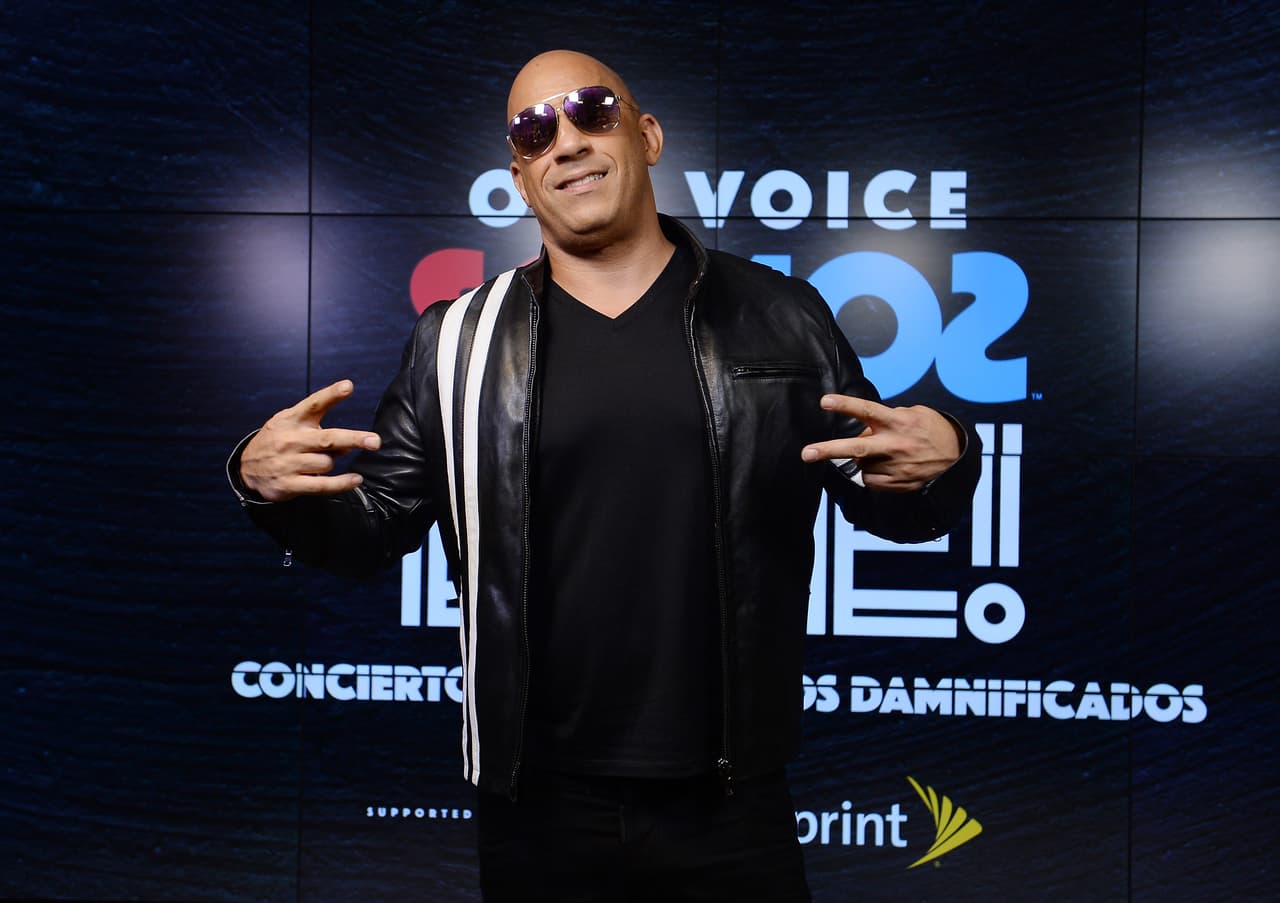MIAMI, FL - OCTOBER 14: In this handout photo provided by One Voice: Somos Live!, Vin Diesel poses in the pressroom at One Voice: Somos Live! A Concert For Disaster Relief at Marlins Park on October 14, 2017 in Miami, Florida. (Photo by Jason Koerner/One Voice: Somos Live!/Getty Images)