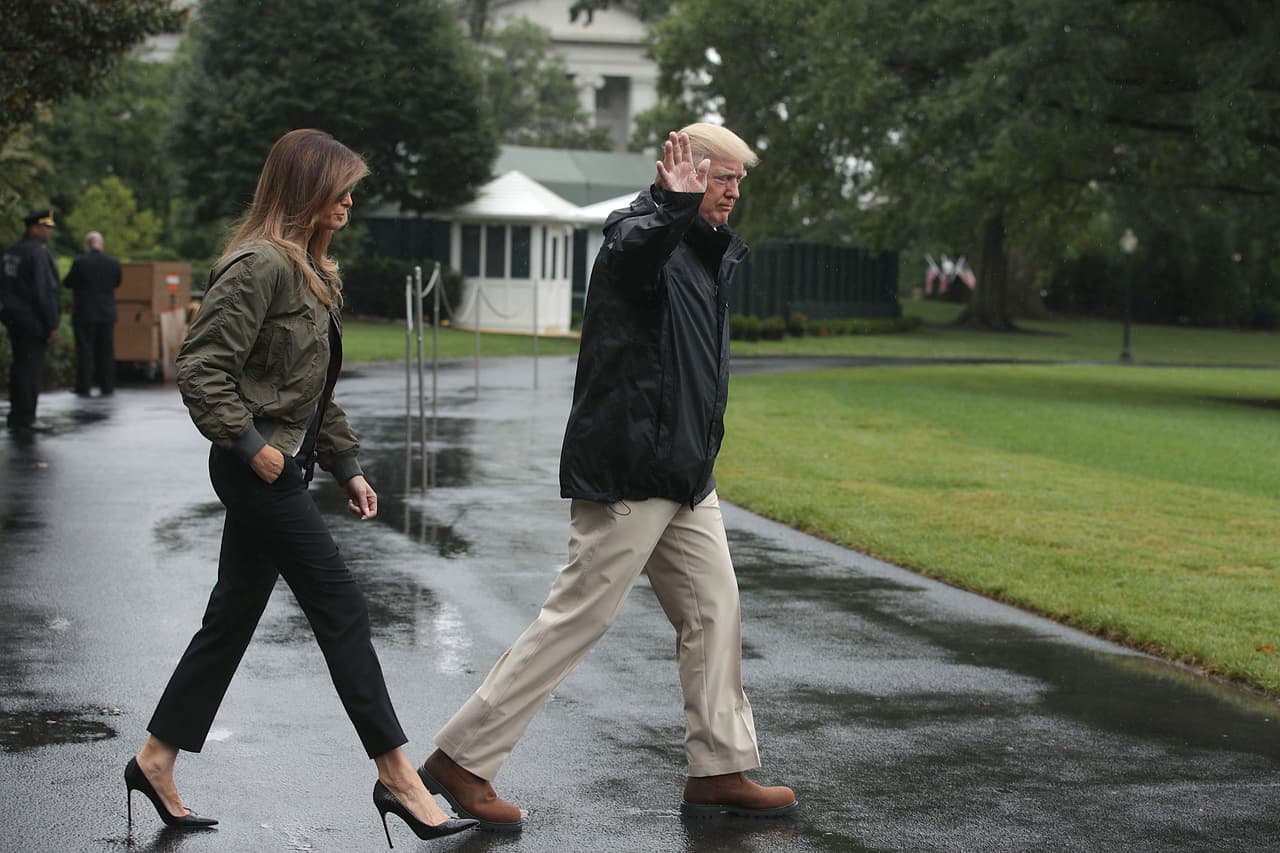 WASHINGTON, DC - AUGUST 29: U.S. President Donald Trump walks with first lady Melania Trump prior to their Marine One departure from the White House August 29, 2017 in Washington, DC. President Trump was traveling to Texas to observe the Hurricane Harvey relief efforts. (Photo by Alex Wong/Getty Images)