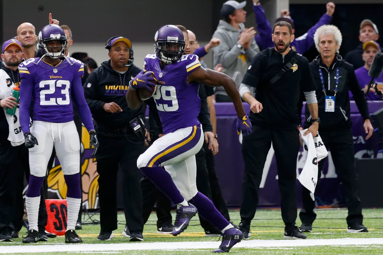 FILE - In this Sunday, Nov. 20, 2016, file photo, Minnesota Vikings cornerback Xavier Rhodes returns an interception 100-yards for a touchdown during the first half of an NFL football game against the Arizona Cardinals in Minneapolis. Rhodes and Jacksonville’s Jalen Ramsey are two of the best young cornerbacks in the NFL. (AP Photo/Jim Mone, File)