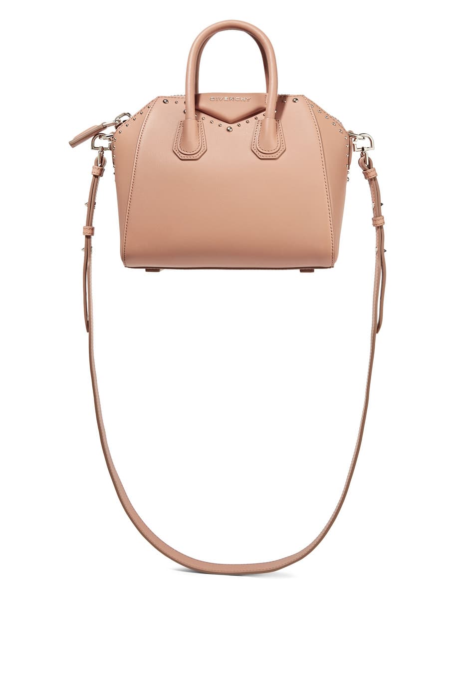 Las carteras pequeñas, compactas de larga y delgada correa de cuero son otro de esos objetos de adoración fashionistas. Mejor si es es una rosa o color salmón (Givenchy) 
<br>