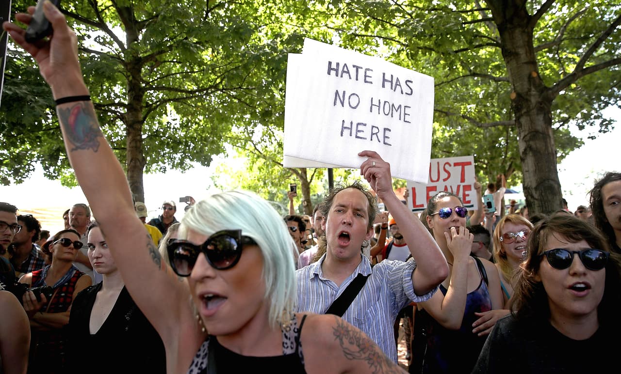 CHARLOTTESVILLE, VA - AUGUST 13: Counter protesters shout after Jason Kessler, an organizer of "Unite the Right" rally, fled after trying to speak outside the Charlottesville City Hall on August 13, 2017 in Charlottesville, Virginia. The city of Charlottesville remains on edge following violence at a 'Unite the Right' rally held by white nationalists, neo-Nazis and members of the 'alt-right' (Photo by Win McNamee/Getty Images)
