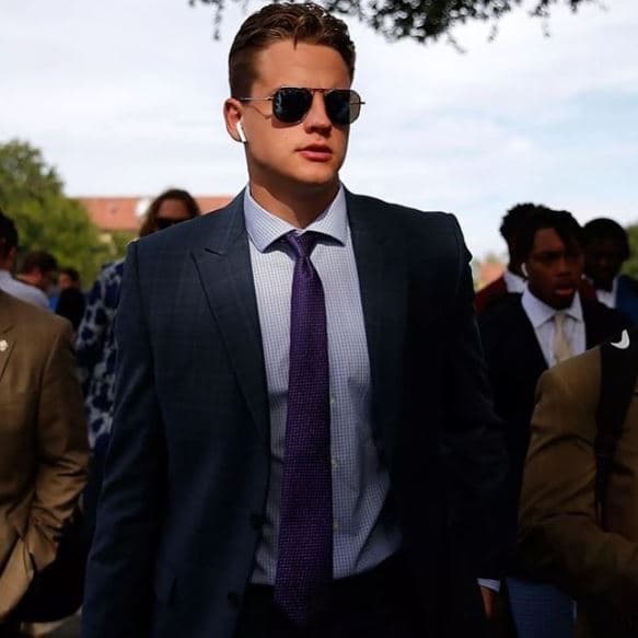 Jugó al fútbol universitario para la Universidad Estatal de Ohio ganando el campeonato nacional en 2019 y con ello el Trofeo Heisman.