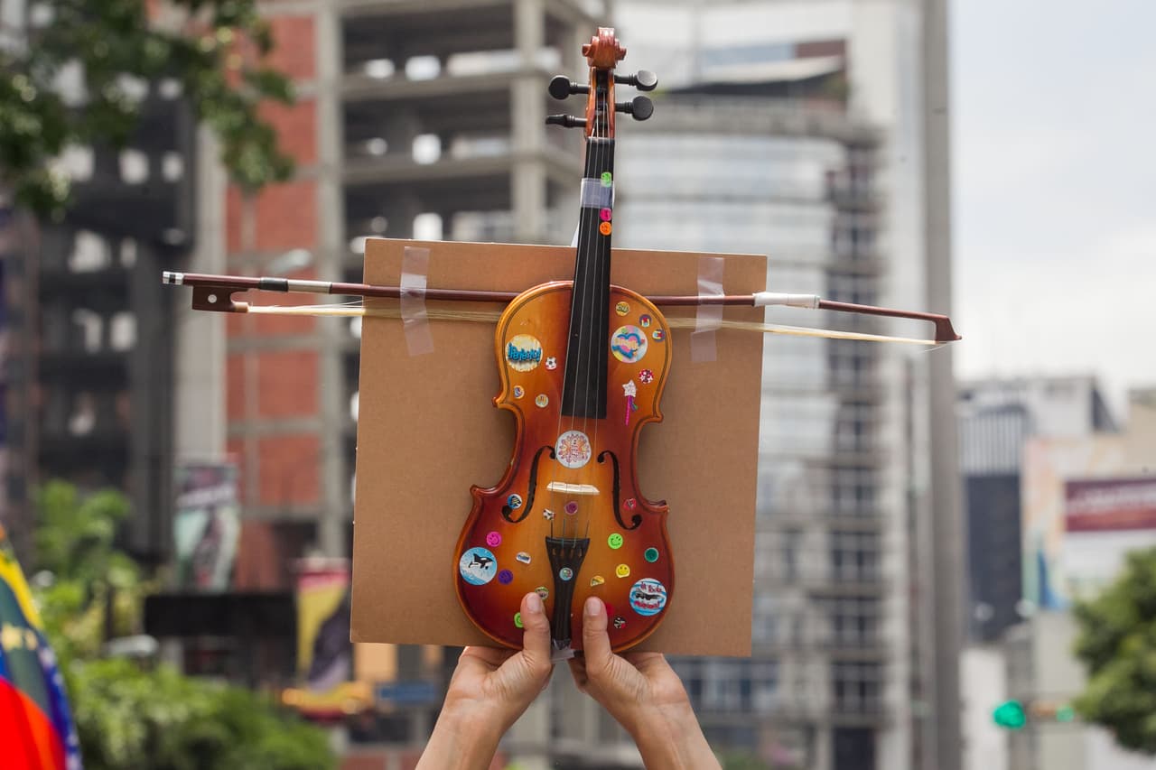 In violin is raised at an anti-goverment march on Sunday. May 7, 2017.
<br>