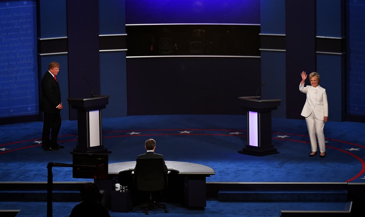 LAS VEGAS, NV - OCTOBER 19: Democratic presidential nominee former Secretary of State Hillary Clinton (R) and Republican presidential nominee Donald Trump (L) walk onto the stage during the third U.S. presidential debate at the Thomas & Mack Center on October 19, 2016 in Las Vegas, Nevada. Tonight is the final debate ahead of Election Day on November 8. (Photo by Ethan Miller/Getty Images)
