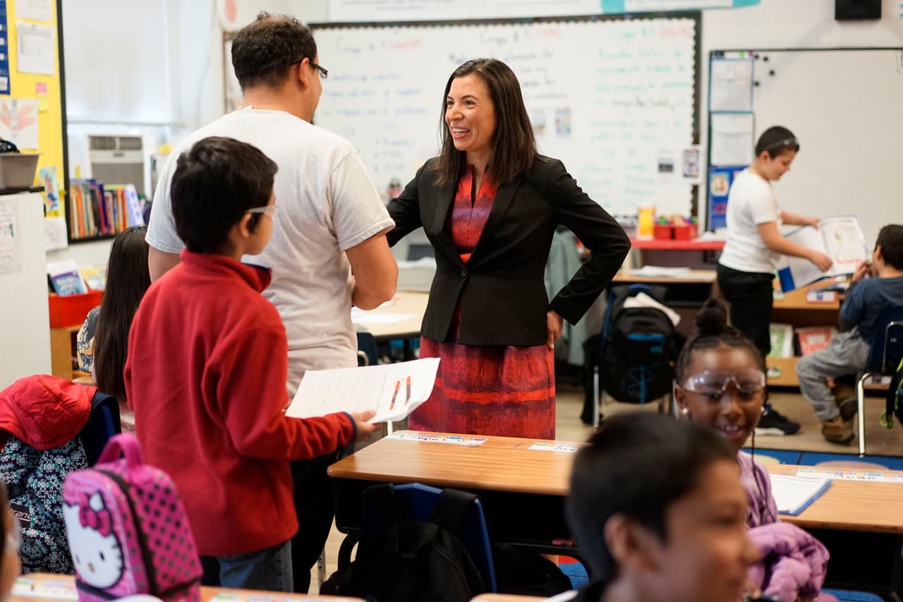 Daniela Anello, Head of School at the DC Bilingual Public Charter School says hello with third grade teacher Miguel Amaya on Thursday Nov. 16, 2017 in Washington D.C.