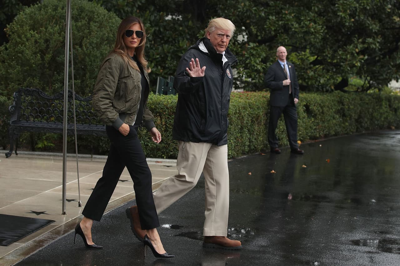 WASHINGTON, DC - AUGUST 29: U.S. President Donald Trump walks with first lady Melania Trump prior to their Marine One departure from the White House August 29, 2017 in Washington, DC. President Trump was traveling to Texas to observe the Hurricane Harvey relief efforts. (Photo by Alex Wong/Getty Images)