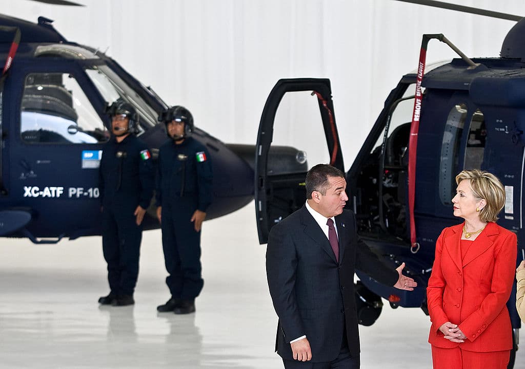 US Secretary of State Hillary Clinton (L) gestures next to the Secretary of the Federal Public Security Genaro Garcia Luna upon her arrival to the Center Command of the Mexican Federal Police in Mexico City, on March 26, 2009. Clinton is in Mexico for a two-day visit.