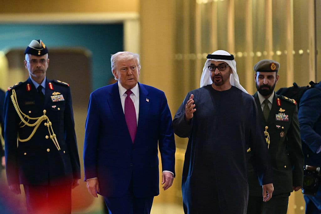 UAE President Sheikh Mohamed bin Zayed Al Nahyan (R) welcomes his US counterpart Donald Trump upon arrival at the presidential terminal in Abu Dhabi on May 15, 2025. The United Arab Emirates is the third leg of Trump's visit to the region, which has already taken him to Saudi Arabia and Qatar. (Photo by Giuseppe CACACE / AFP) (Photo by GIUSEPPE CACACE/AFP via Getty Images)