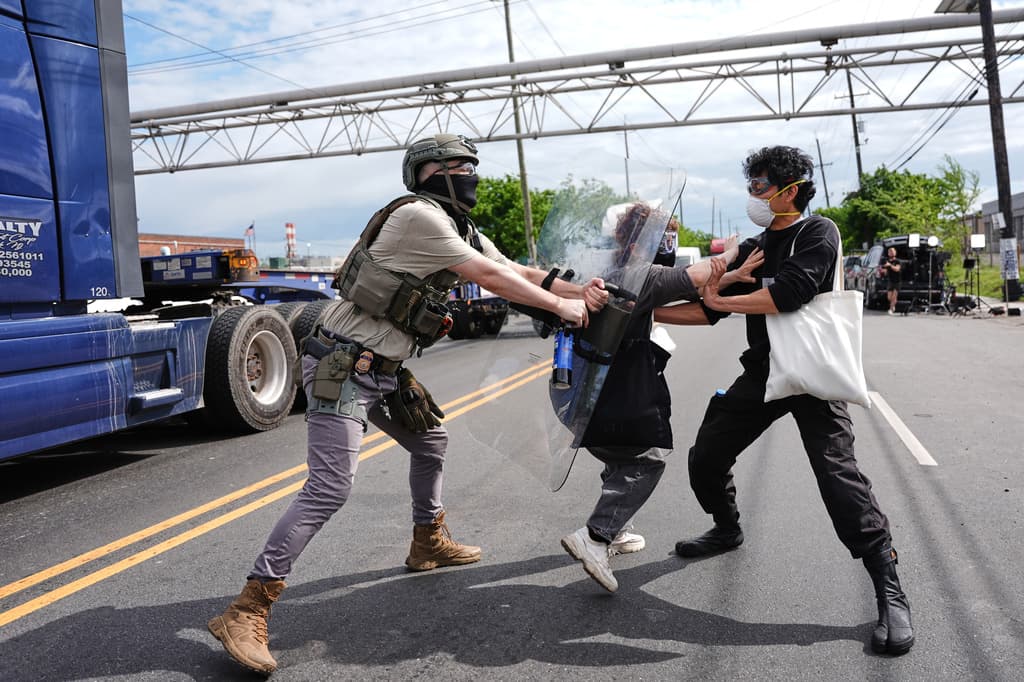 Federal immigration officers confront protesters outside the Delaney Hall detention center Thursday, May 28, 2026, in Newark, N.J. (AP Photo/Angelina Katsanis)