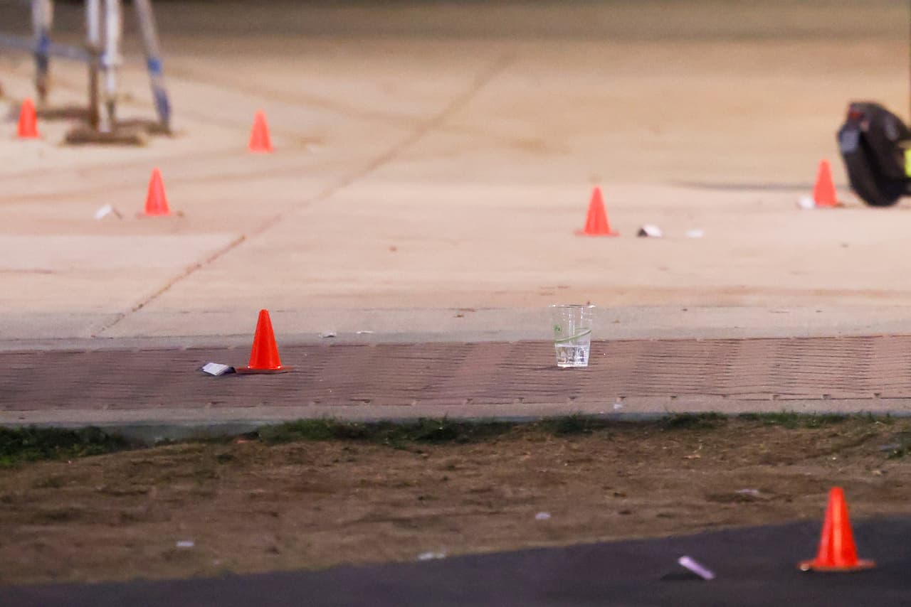 Evidence markers are pictured outside a building at Morgan State University after a shooting Wednesday, Oct. 4, 2023, in Baltimore. (AP Photo/Julia Nikhinson)