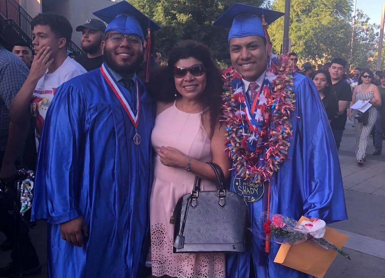 Marta Vazquez with her twin son Kevin and Josue at their high school graduation in 2018.