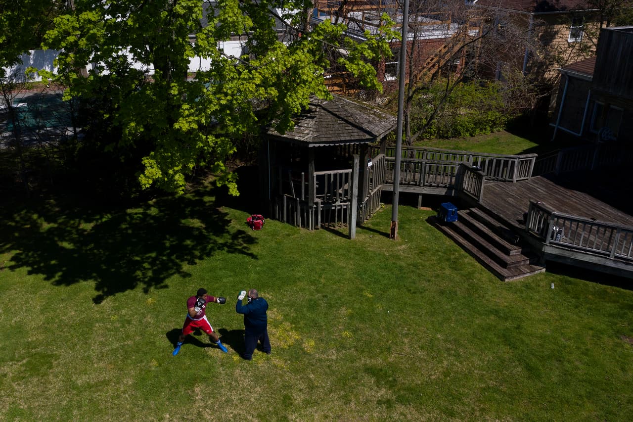 MINEOLA, NEW YORK - MAY 02: An aerial view of amateur Middleweight boxer Kevens Desroches training in the backyard with Westbury Boxing Club Trainer Matt Happaney on May 02, 2020 in Mineola, New York. Local Amateur Boxers have continued To train as best they can during coronavirus COVID-19 Pandemic. The World Health Organization declared coronavirus (COVID-19) a global pandemic on March 11th. (Photo by Al Bello/Getty Images)