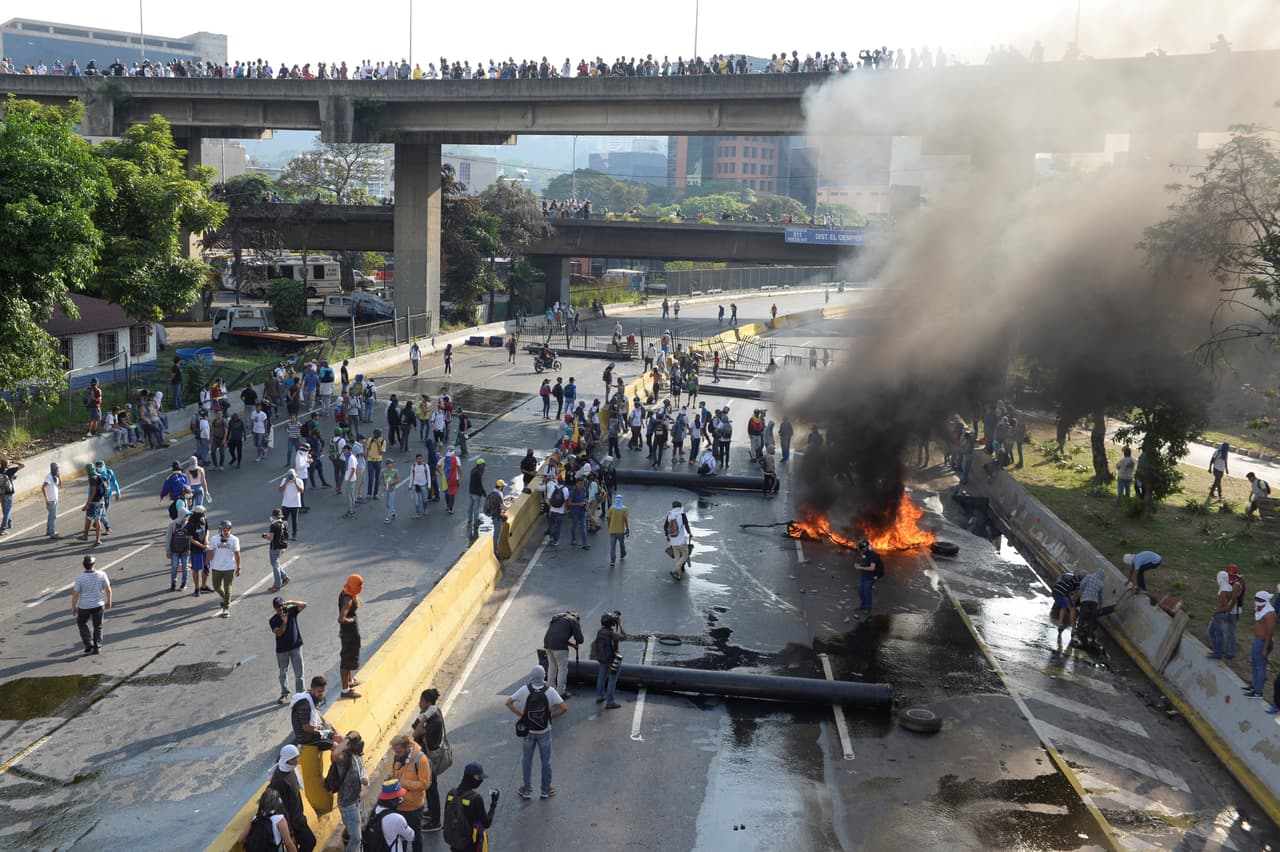 A barricade with tubes and metal debris on the main highway that connects east to west Caracas. Demonstraors also removed slabs of concrete from the side of freeways.