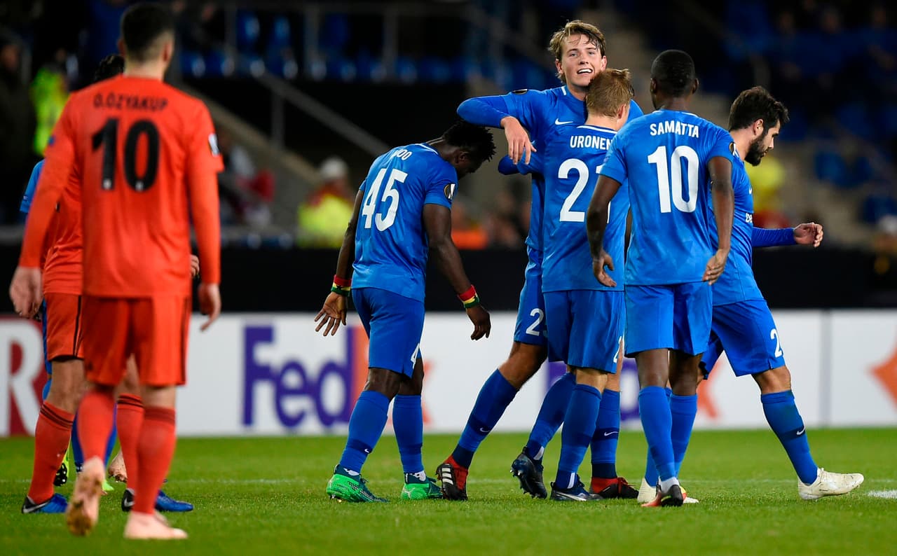 Genk's Sander Berge celebrates with Jere Uronen after scoring against Besiktas during the UEFA Europa League football match between Genk and Besiktas at the Luminus Arena Stadium in Genk on November 8, 2018. (Photo by JOHN THYS / AFP) (Photo credit should read JOHN THYS/AFP via Getty Images)
