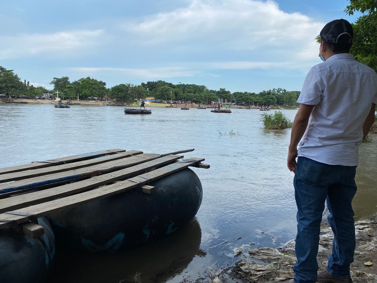 A Mexican man contemplates the Suchiate River, dividing Mexico and Guatemala. Some 280 rafts, all Guatemalan, are running 24-hours a day between Guatemala and Mexico. They're moving merchandise, drugs, and people.