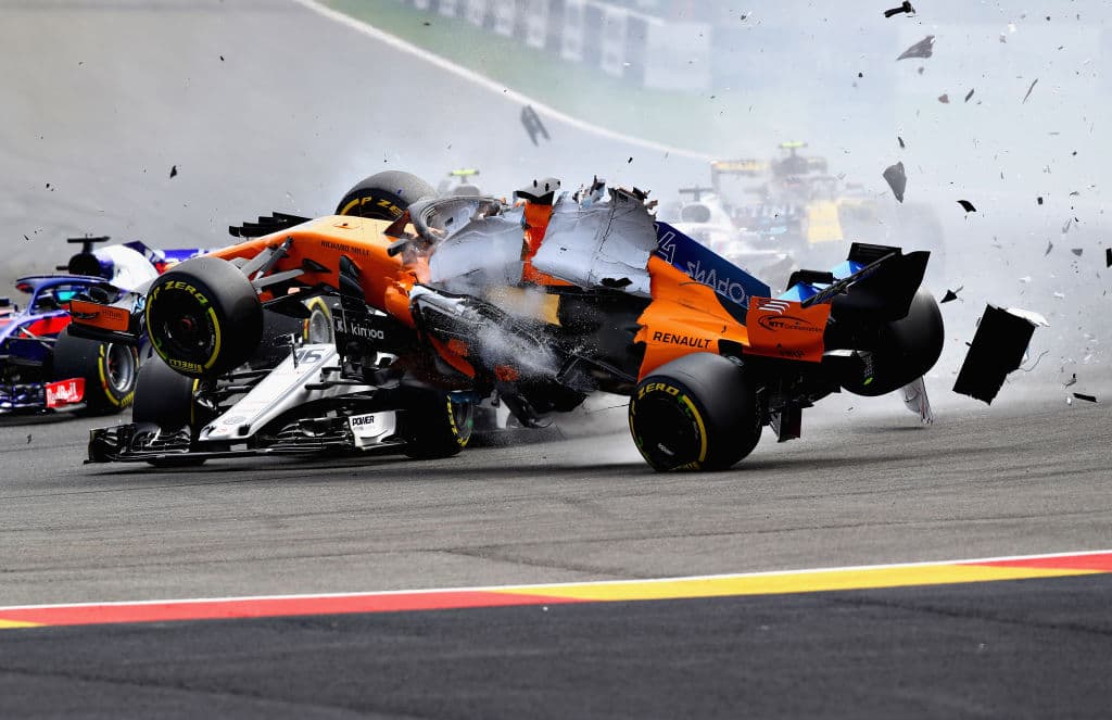 SPA, BELGIUM - AUGUST 26: Fernando Alonso of Spain driving the (14) McLaren F1 Team MCL33 Renault launches over the top of Charles Leclerc of Monaco driving the (16) Alfa Romeo Sauber F1 Team C37 Ferrari at the start during the Formula One Grand Prix of Belgium at Circuit de Spa-Francorchamps on August 26, 2018 in Spa, Belgium. (Photo by Mark Thompson/Getty Images)