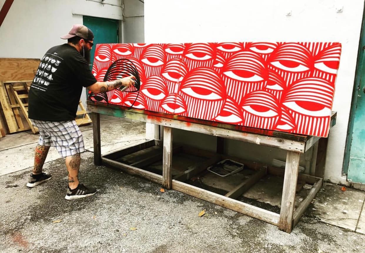 Artist Ahol Sniffs Glue creates custom art for our space.