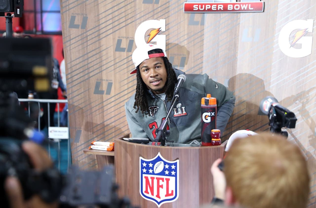 Atlanta Falcons running back Devonta Freeman (24) speaks during Super Bowl LI Opening Night at Minute Maid Park on Monday, Jan. 30, 2017 in Houston. (Ben Liebenberg via AP)