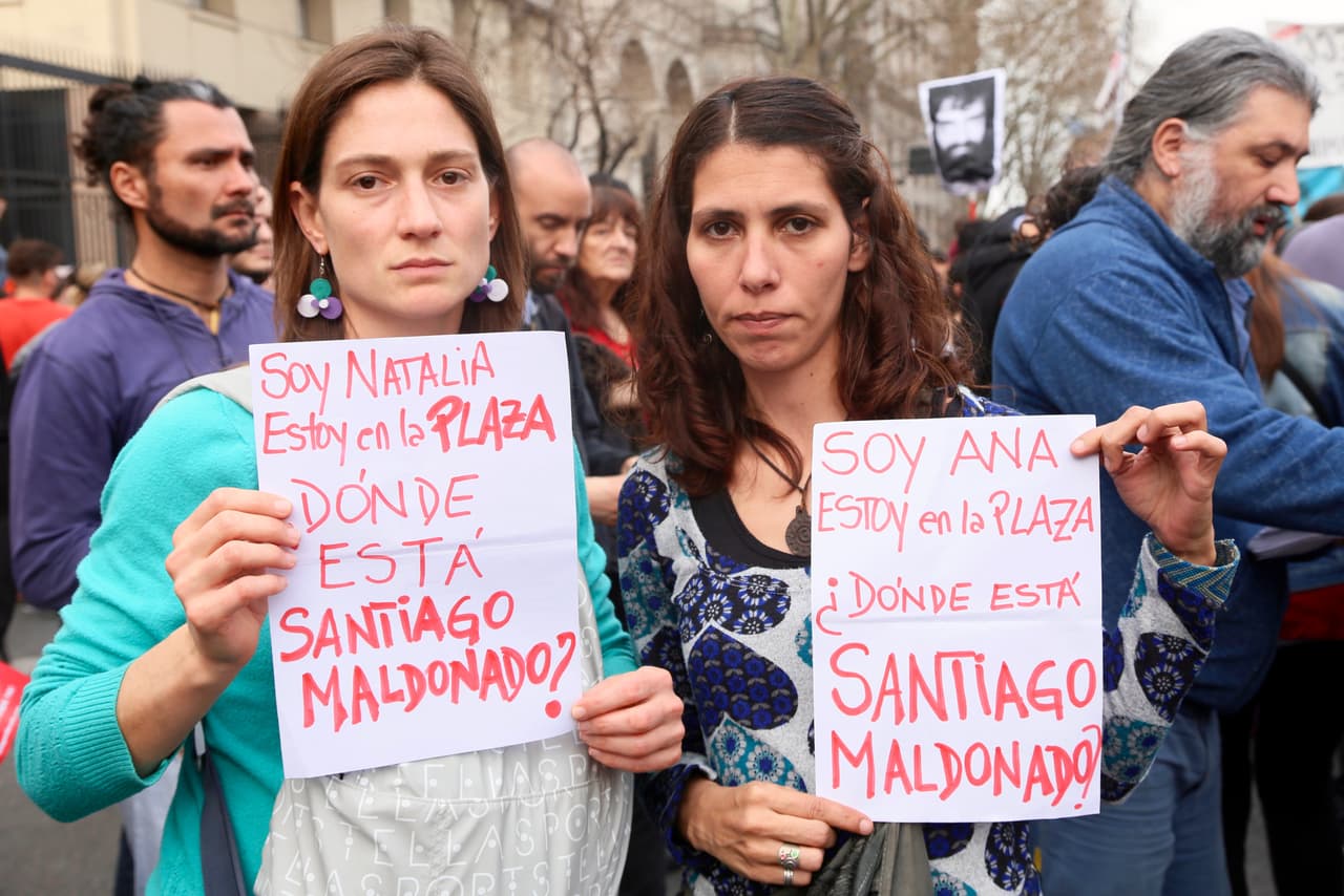 Two female protestors hold up signs during a Sept. 1, 2017 protest in Buenos Aires.