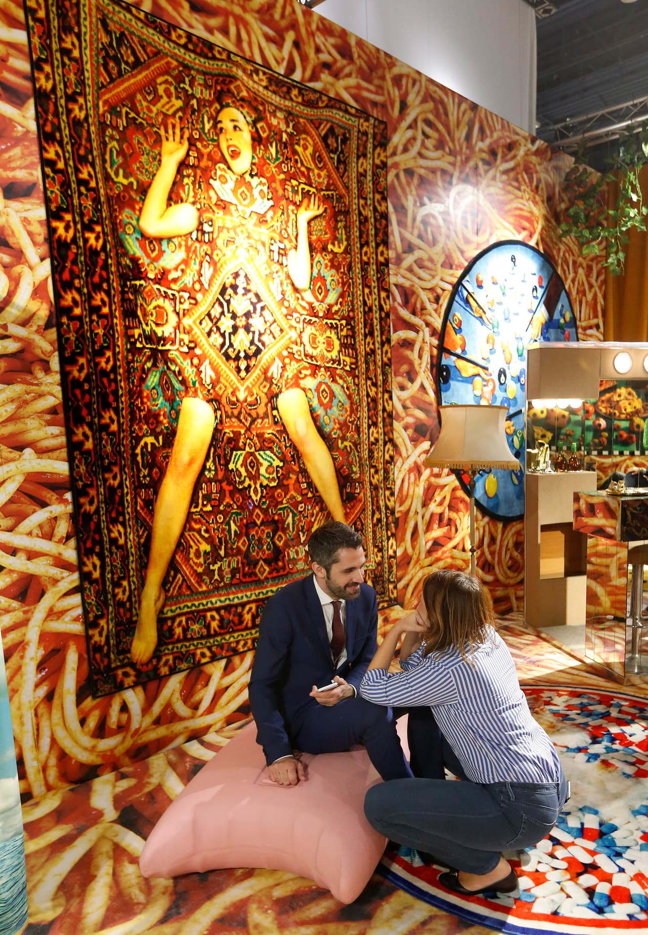 Art patrons sit inside The Fondation Beyeler gallery during Art Basel in Miami on November 30, 2016. Art Basel represents over 250 art galleries at the Miami Beach Convention Center and is considered one of the world's largest art festivals with art events throughout the city. / AFP / RHONA WISE / RESTRICTED TO EDITORIAL USE - MANDATORY MENTION OF THE ARTIST UPON PUBLICATION - TO ILLUSTRATE THE EVENT AS SPECIFIED IN THE CAPTION (Photo credit should read RHONA WISE/AFP/Getty Images)