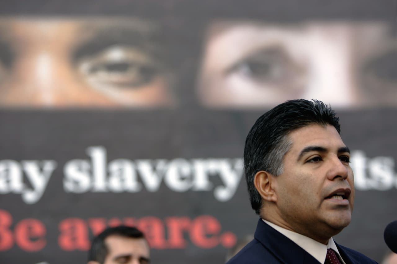 Los Angeles, UNITED STATES: Councilmen Tony Cardenas delivers a speech to a group of reporters during a press conference announcing the National Human Trafficking Awareness Day in Los Angeles, CA 11 January 2007. City officials have created a Metropolitan Task Force to combat modern slavery and human trafficking and have received a federal grant of 450,000 USD to be used to train police officers in how to better recognize signs of human trafficking in their day-to-day duties. AFP PHOTO / HECTOR MATA (Photo credit should read HECTOR MATA/AFP/Getty Images)