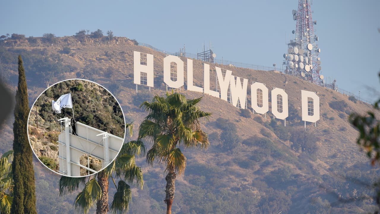 Hombre escala el letrero de Hollywood para ondear bandera publicitaria; fue arrestado