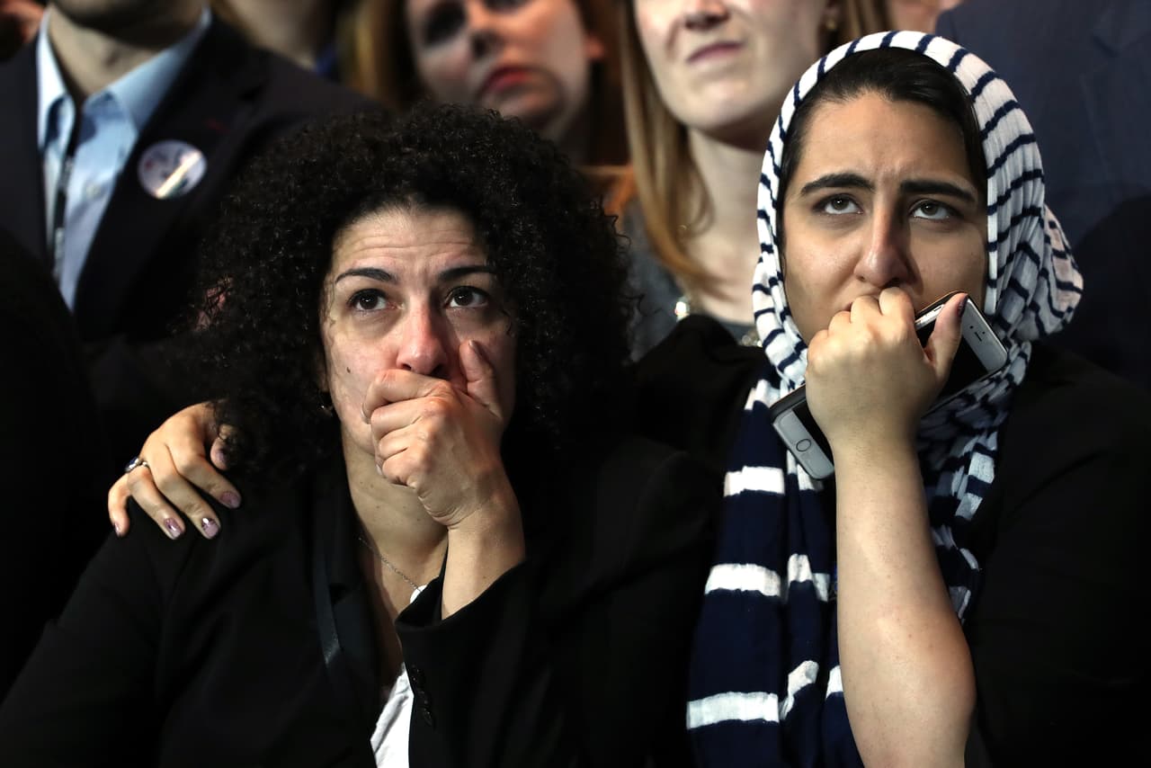 NEW YORK, NY - NOVEMBER 08: Two women hold their faces as they watch voting results at Democratic presidential nominee former Secretary of State Hillary Clinton's election night event at the Jacob K. Javits Convention Center November 8, 2016 in New York City. Clinton is running against Republican nominee, Donald J. Trump to be the 45th President of the United States. (Photo by Win McNamee/Getty Images)