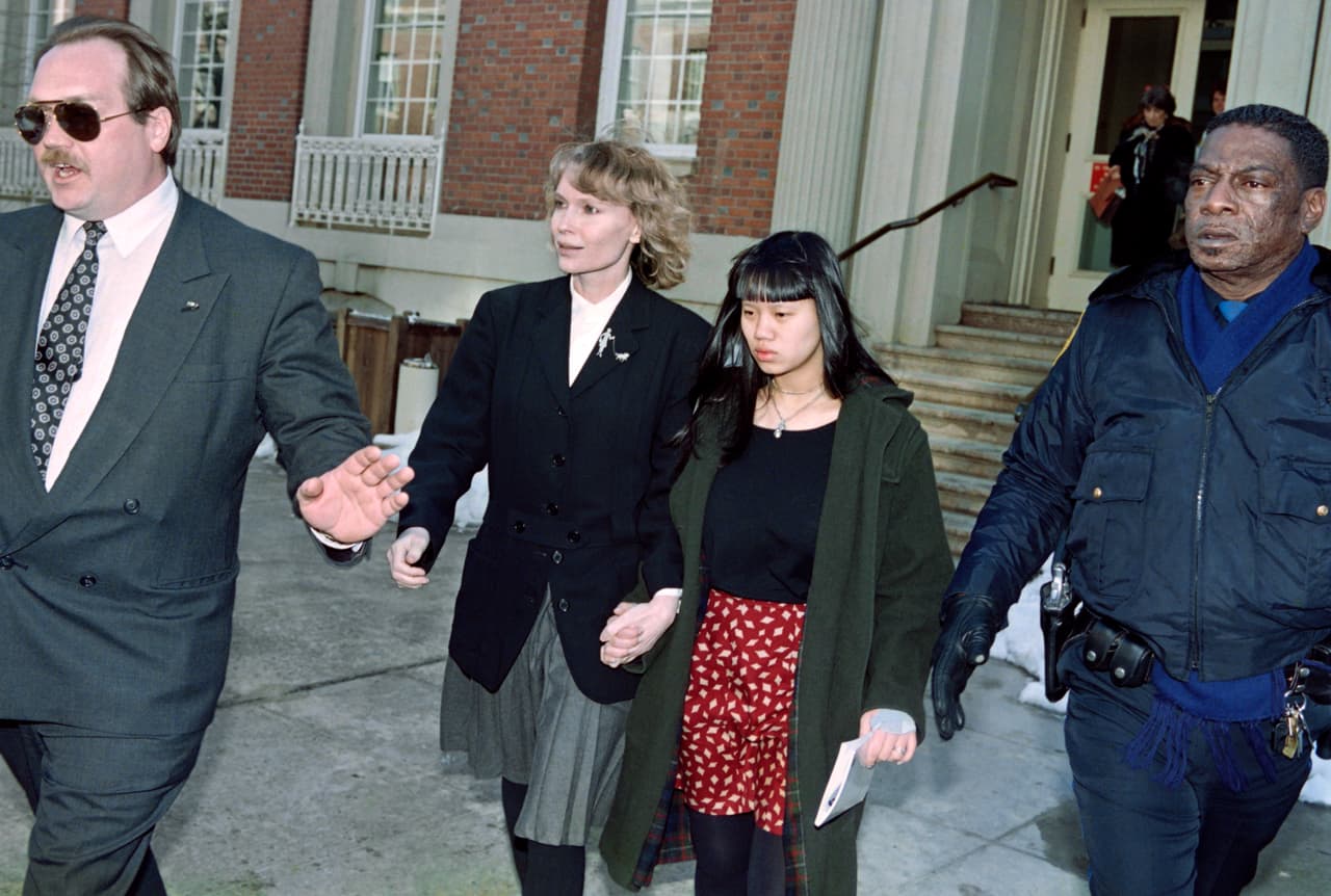 This picture taken on March 18, 1993 shows US actress Mia Farrow (2nd L) leaving Yale New Haven hospital with her daughter Lark after a 2 1/2 hour meeting with psychiatrists and Woody Allen. Psychiatrists cleared Allen of allegations brought by Farrow that he sexually abused their children. In an exclusive interview published on October 2, 2013, Farrow has admitted Frank Sinatra, and not Woody Allen, may have been the father of her son Ronan, and described the American crooner and film star as the great love of her life. AFP PHOTO / DON EMMERT (Photo credit should read DON EMMERT/AFP/Getty Images)
