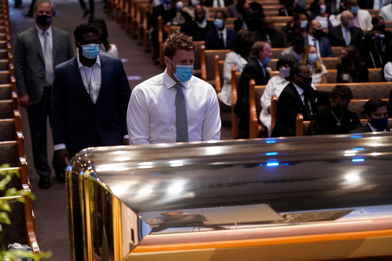 HOUSTON, TEXAS - JUNE 09: J.J. Watt of the NFL Houston Texans pauses at the casket bearing the remains of George Floyd in the chapel during his funeral service at the Fountain of Praise church June 9, 2020 in Houston, Texas. Floyd died May 25 while in Minneapolis police custody, sparking nationwide protests. (Photo by David J. Phillip-Pool/Getty Images)