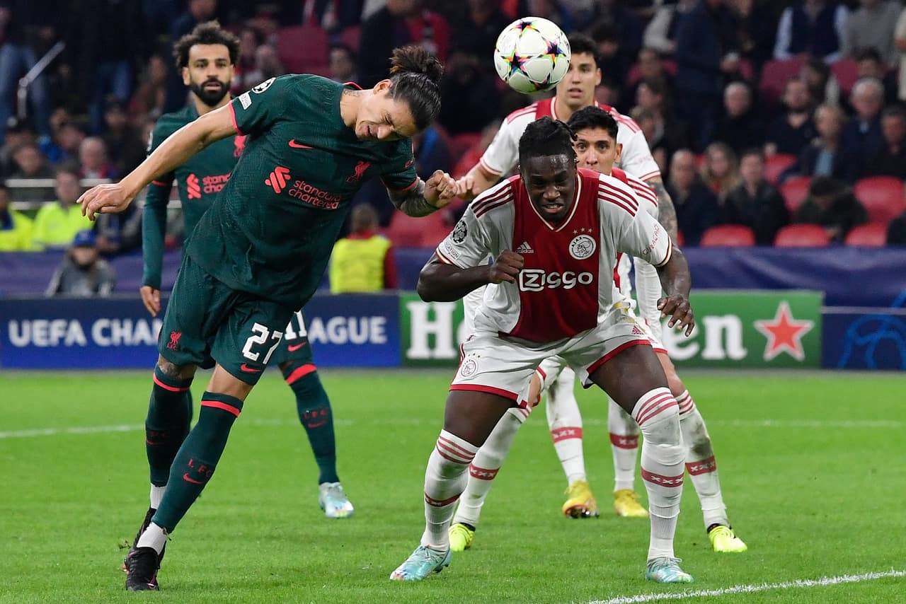 Liverpool's Uruguayan striker Darwin Nunez (L) heads the ball to score his team's second goal during the UEFA Champions League group A football match between Ajax Amsterdam and Liverpool at the Johan Cruijff ArenA in Amsterdam, on October 26, 2022. (Photo by JOHN THYS / AFP) (Photo by JOHN THYS/AFP via Getty Images)