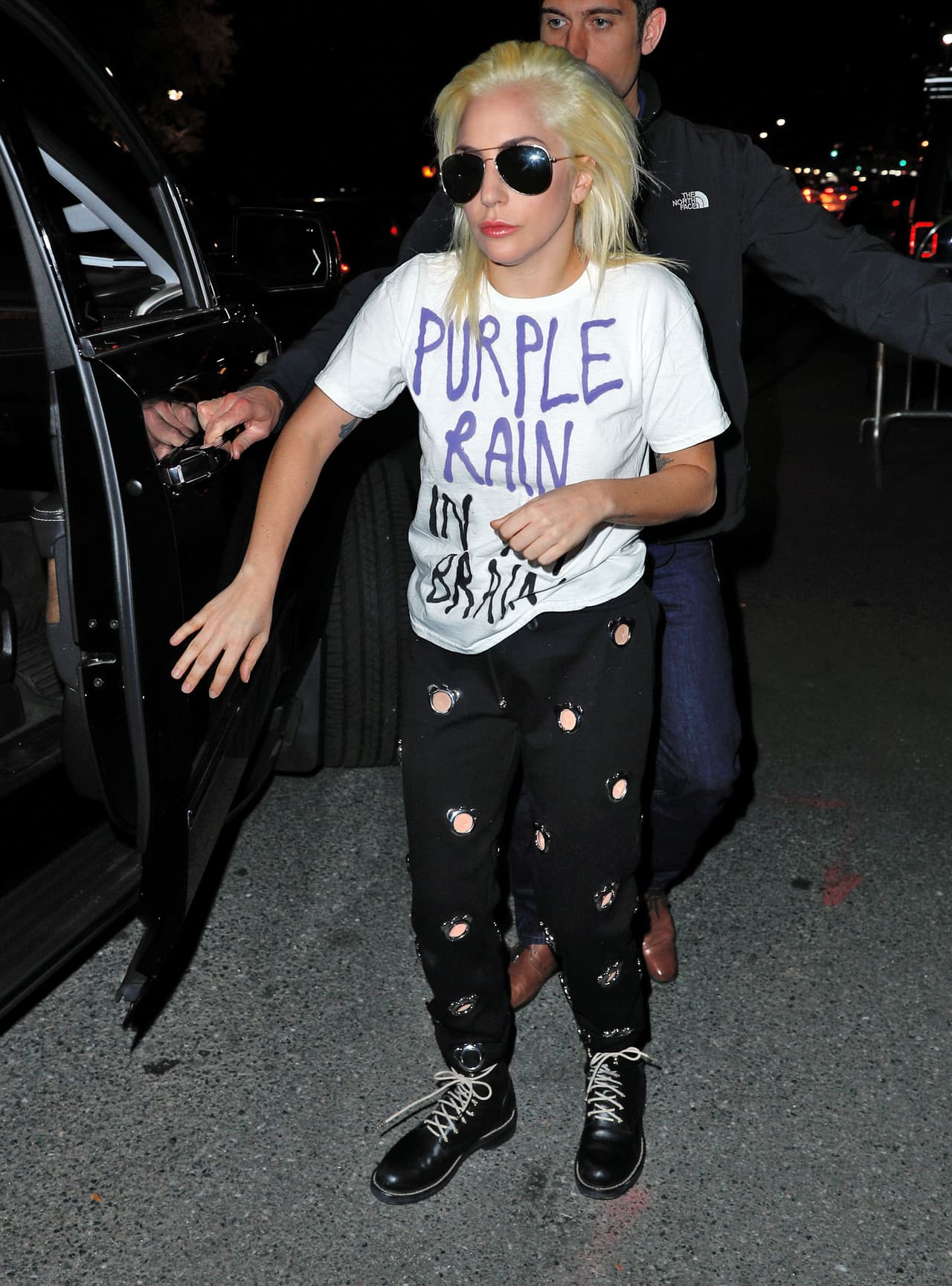 Photo © 2016 Splash News/The Grosby Group New York, November 10, 2016. Lady Gaga is seen leaving her NYC apartment. The 'Joanne' singer keeps it casual as she steps out and greets a few of her little monsters. She sports a shirt that says, 'Purple Rain In My Brain.'